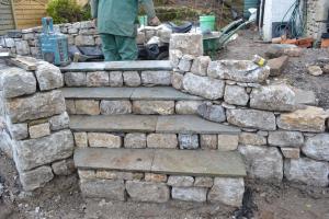 Limestone walling and sandstone steps