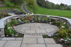 Sandstone Seating Area with Limestone Wall