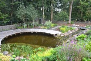 The informal edging contrasts with the formal circular decking
