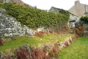 Traditionally built drystone retaining wall in Langdale