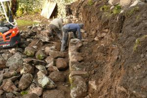 Traditionally built drystone retaining wall in langdale