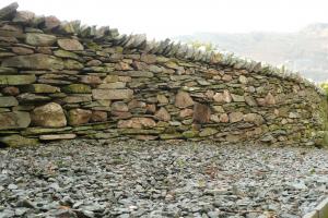 Traditionally built drystone retaining wall in Langdale