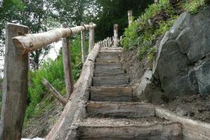 Rustic wooden staircase made from locally sourced cleft oak in the lake District