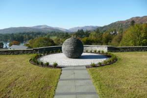 Stone globe garden feature implemented by Chris Rabone Landscapes